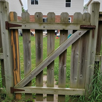 An image of a closed and secured gate to represent reliability and security of ScoopDawg Sqaud's dog poop removal services